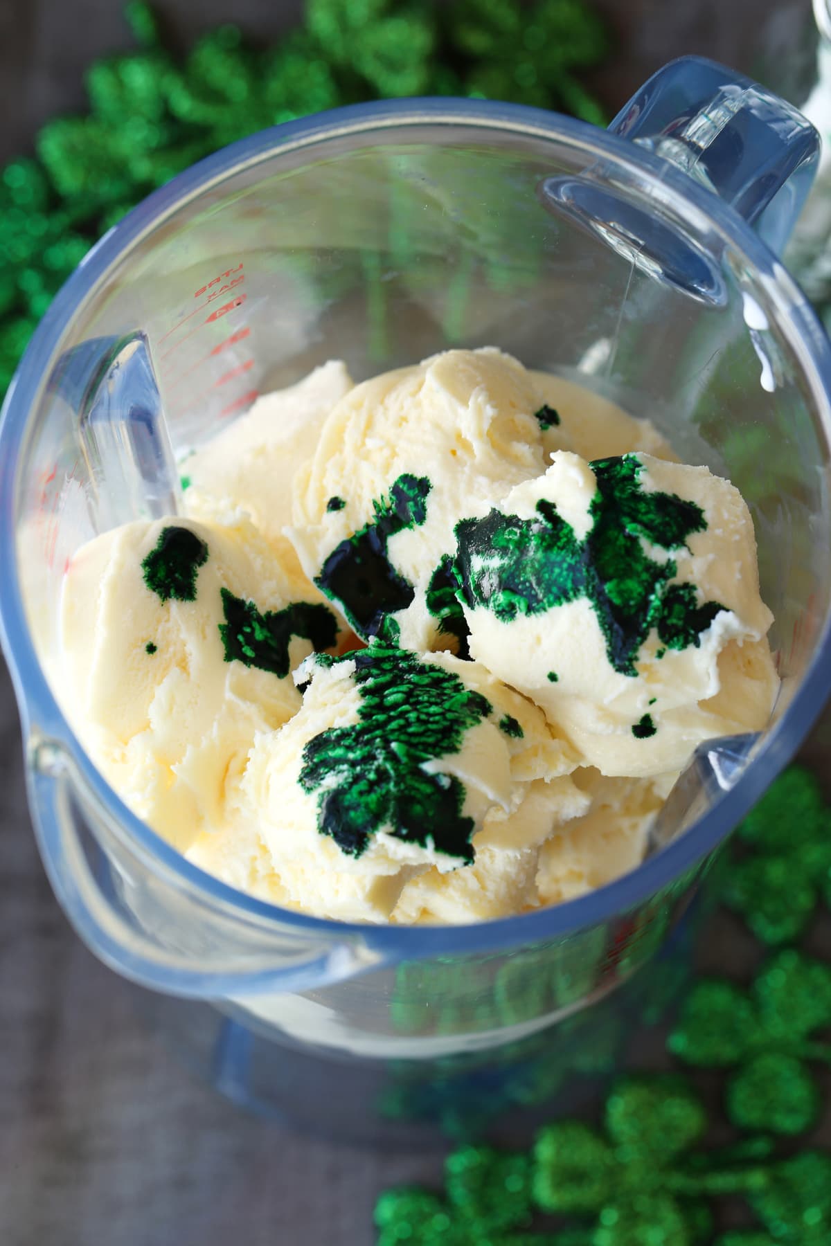 green food coloring and vanilla ice cream in blender