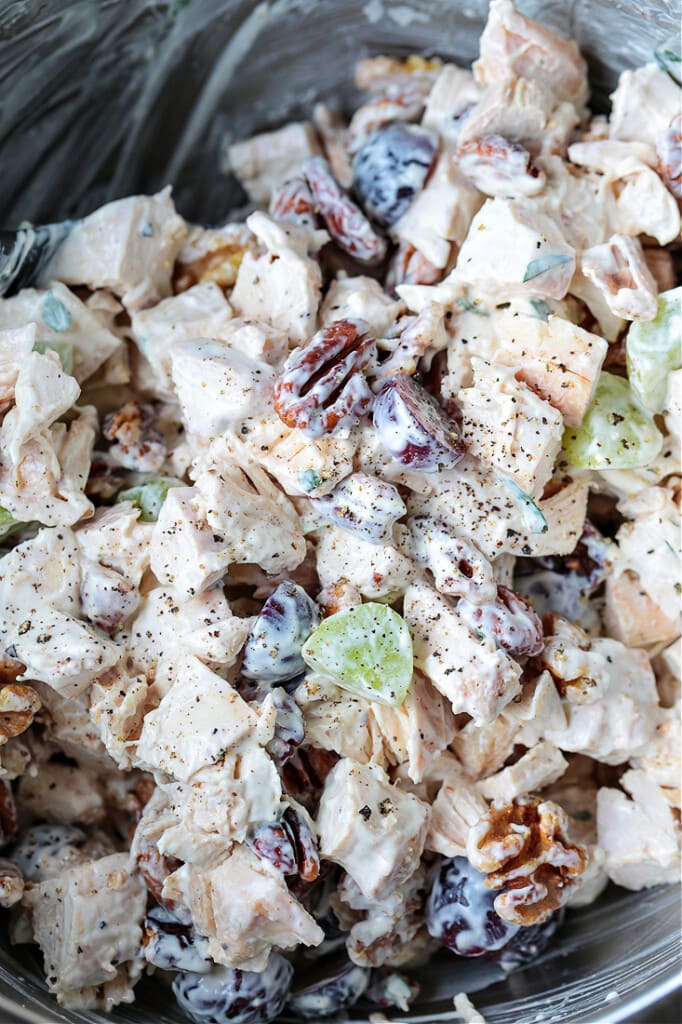 Chicken salad with grapes and walnuts mixed in a bowl