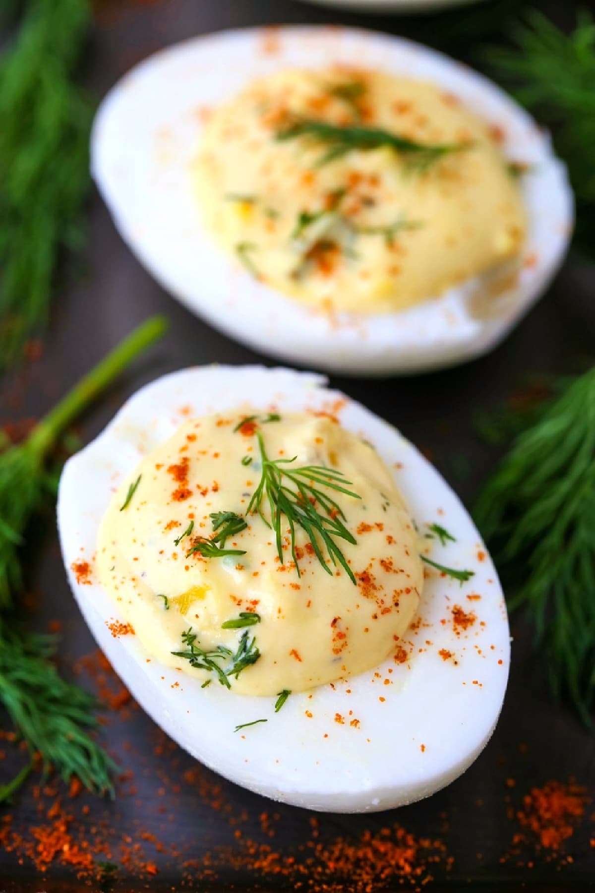 deviled eggs on a black platter