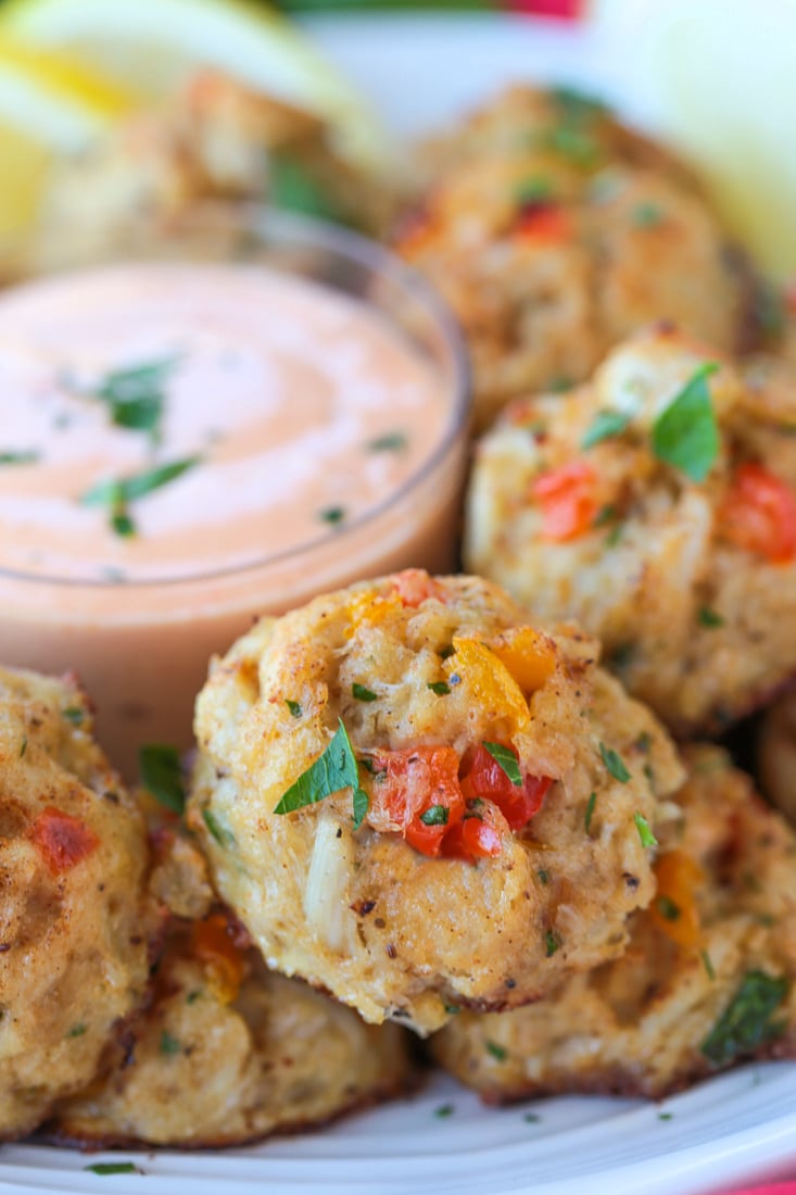 crab appetizers on a plate with remoulade sauce