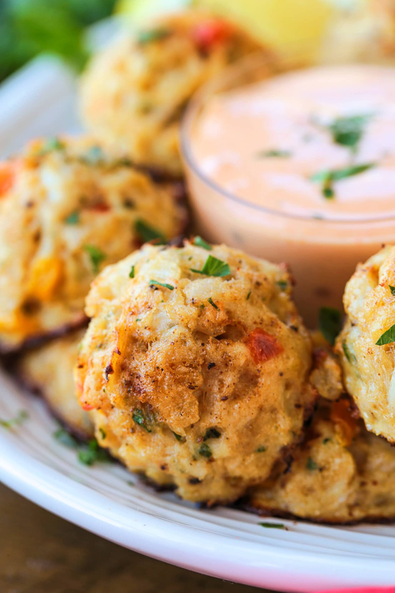 crab balls on plate with dipping sauce