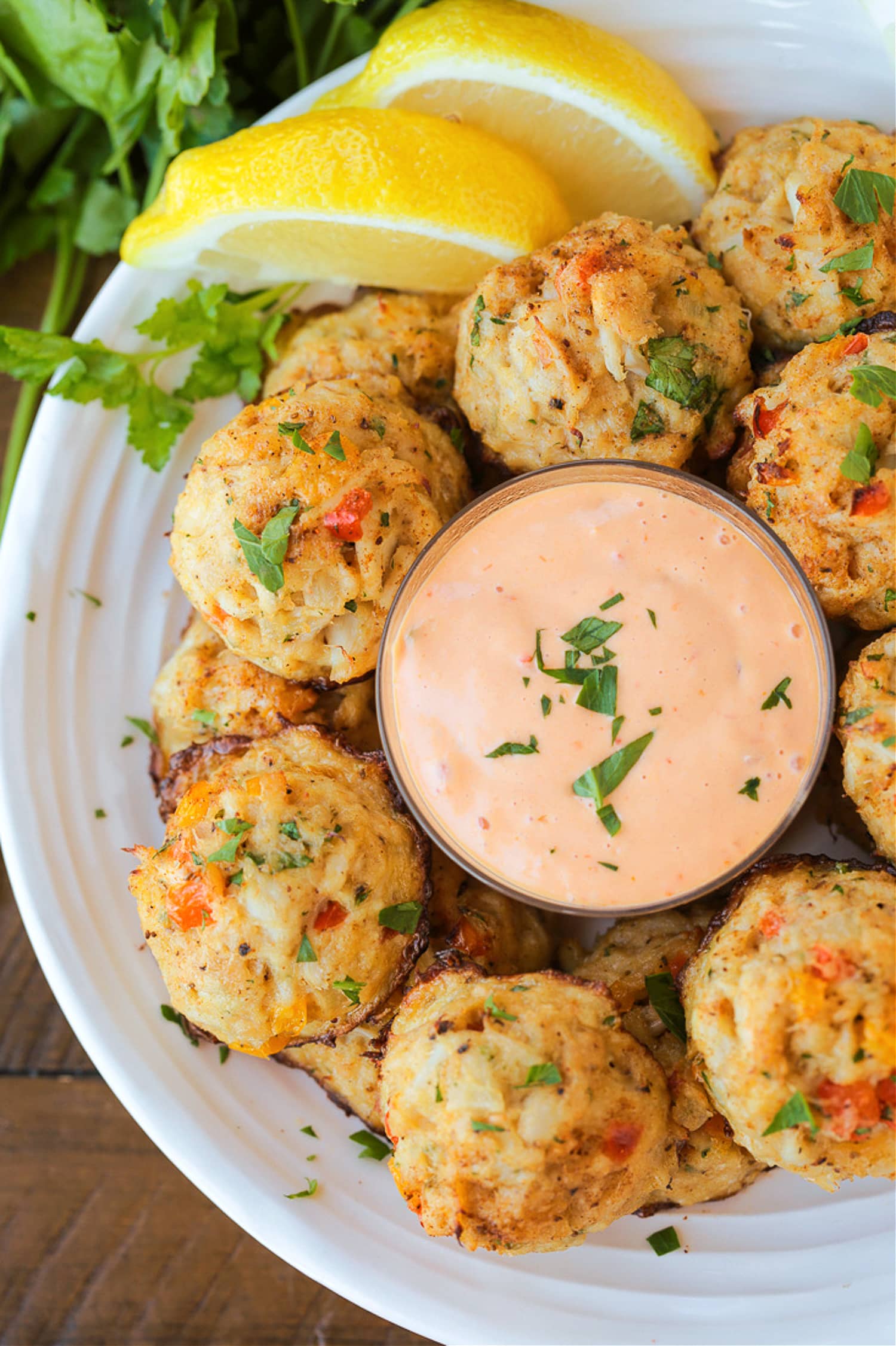 crab balls with remoulade sauce on a plate
