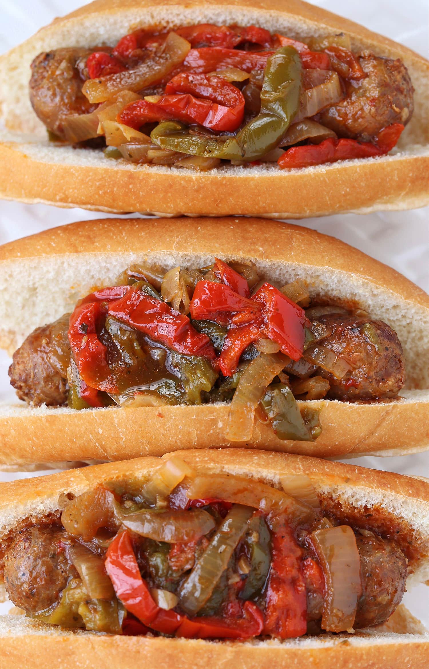 sausage and pepper sandwiches on platter