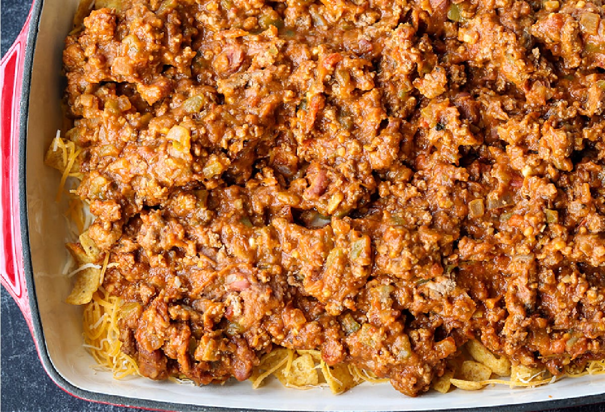ground beef with refried beans in casserole dish