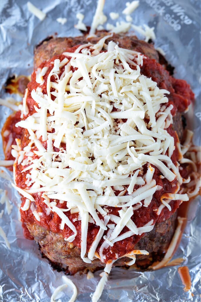 meatloaf topped with sauce and cheese
