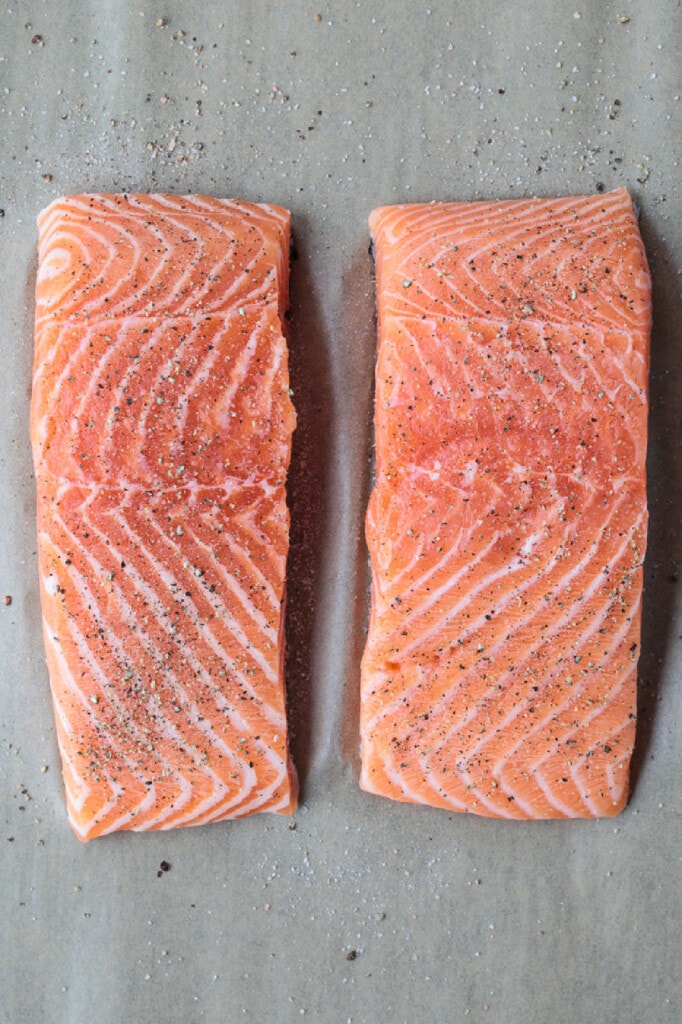 salmon filets on parchment paper