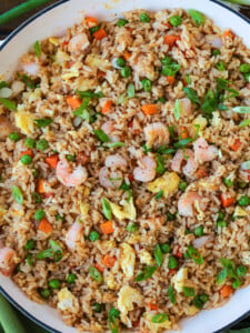 shrimp fried rice in skillet with scallions