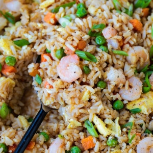shrimp fried rice in a skillet with spoon