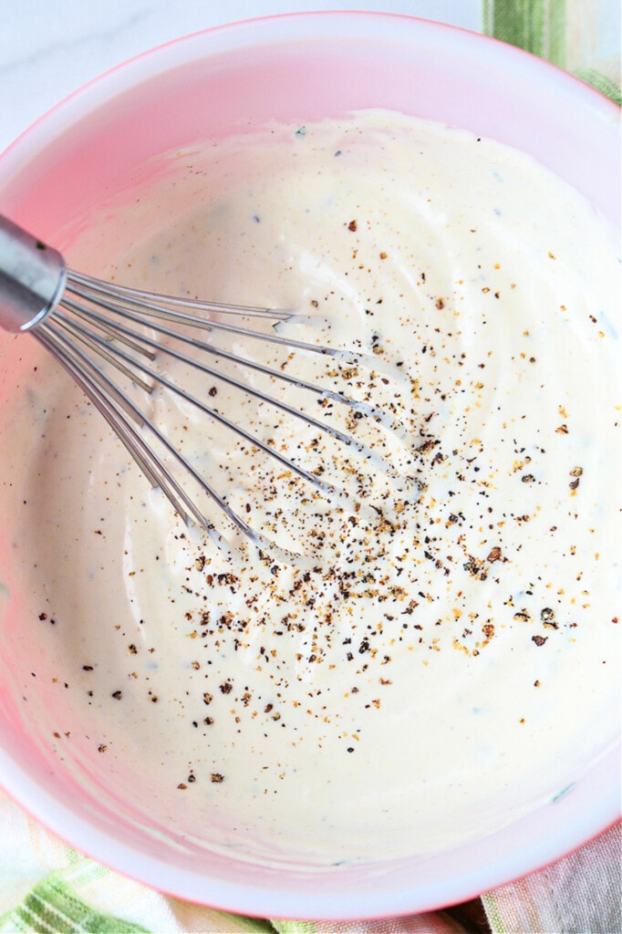 mayonnaise sauce in a bowl with whisk
