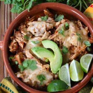 taco chicken in a bowl with cheese and avocado