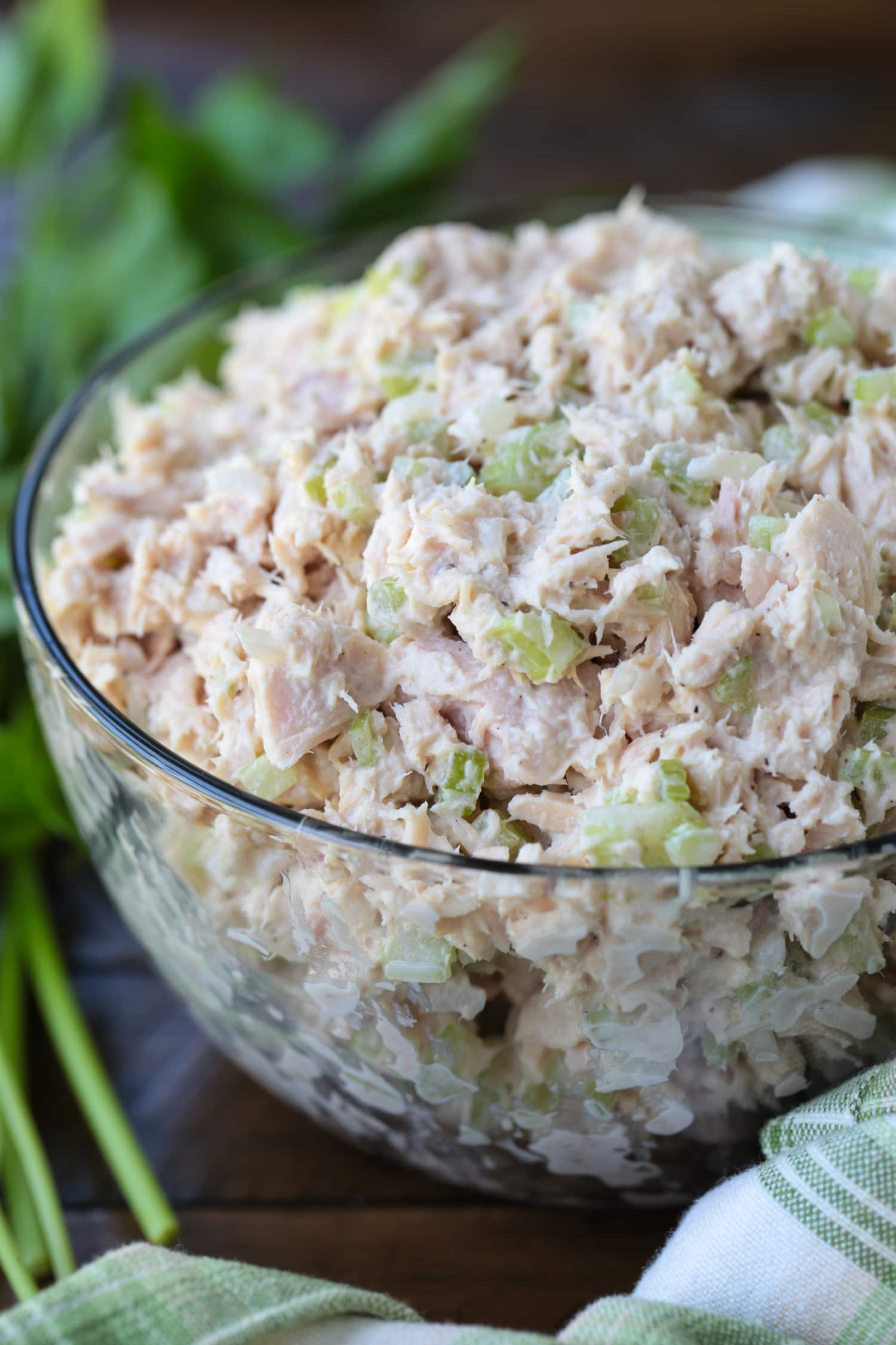 What can be more satisfying than a perfect Tuna Salad Sandwich Recipe? Add on the toppings that you like, piled on bread or a roll for lunch or a light dinner! tuna fish salad in a bowl