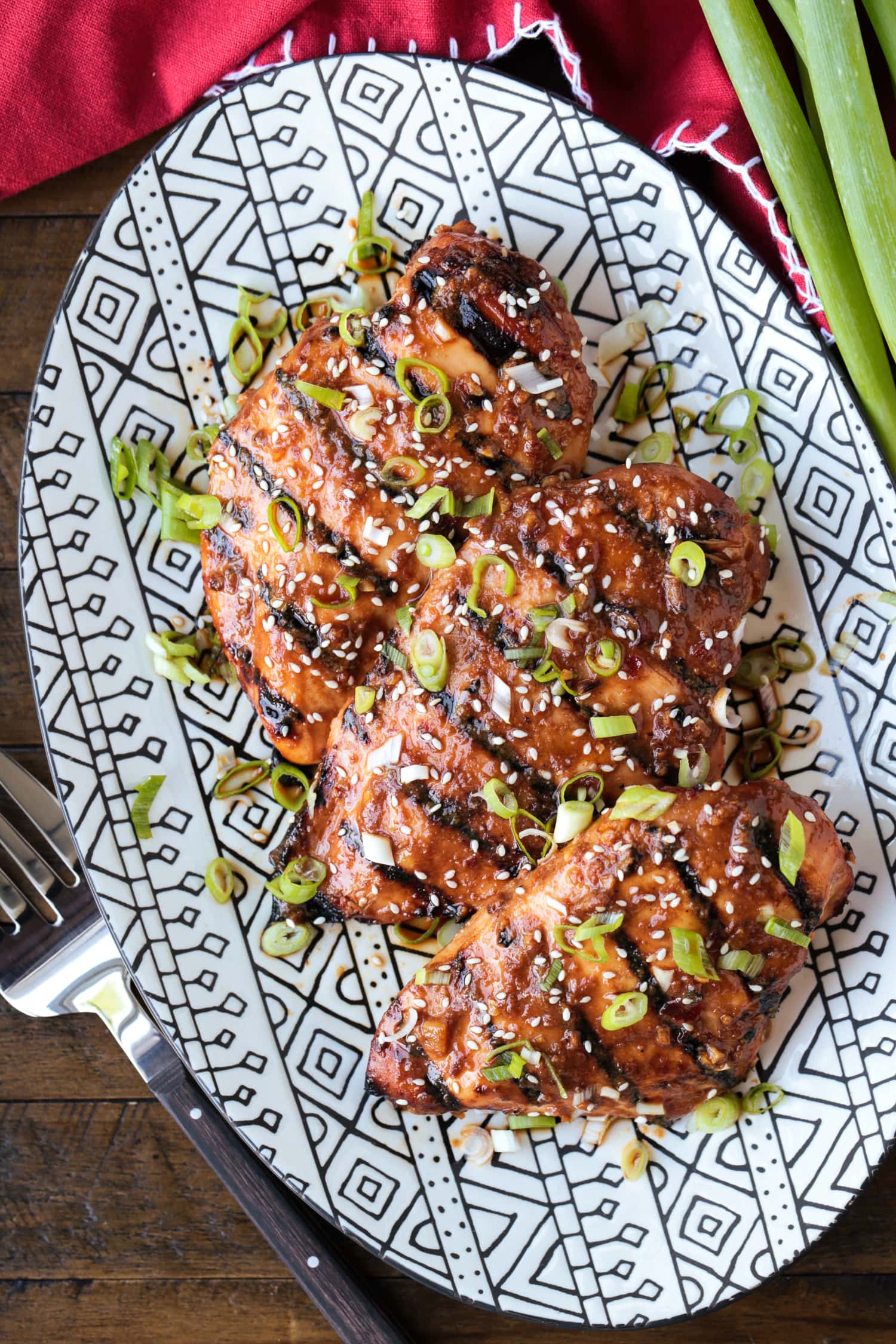chicken breasts on platter with scallions