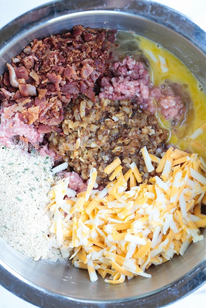 What could be more comforting than a Bacon Meatloaf for dinner? A delicious meatloaf recipe with cheddar cheese and lots of crispy bacon! ingredients for making meatloaf
