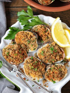 baked clams in shell dish with lemons and parsley