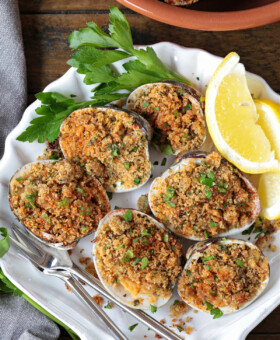 baked clams in shell dish with lemons and parsley