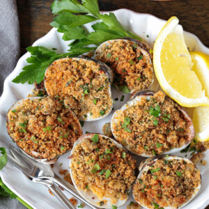 baked clams in shell dish with lemons and parsley