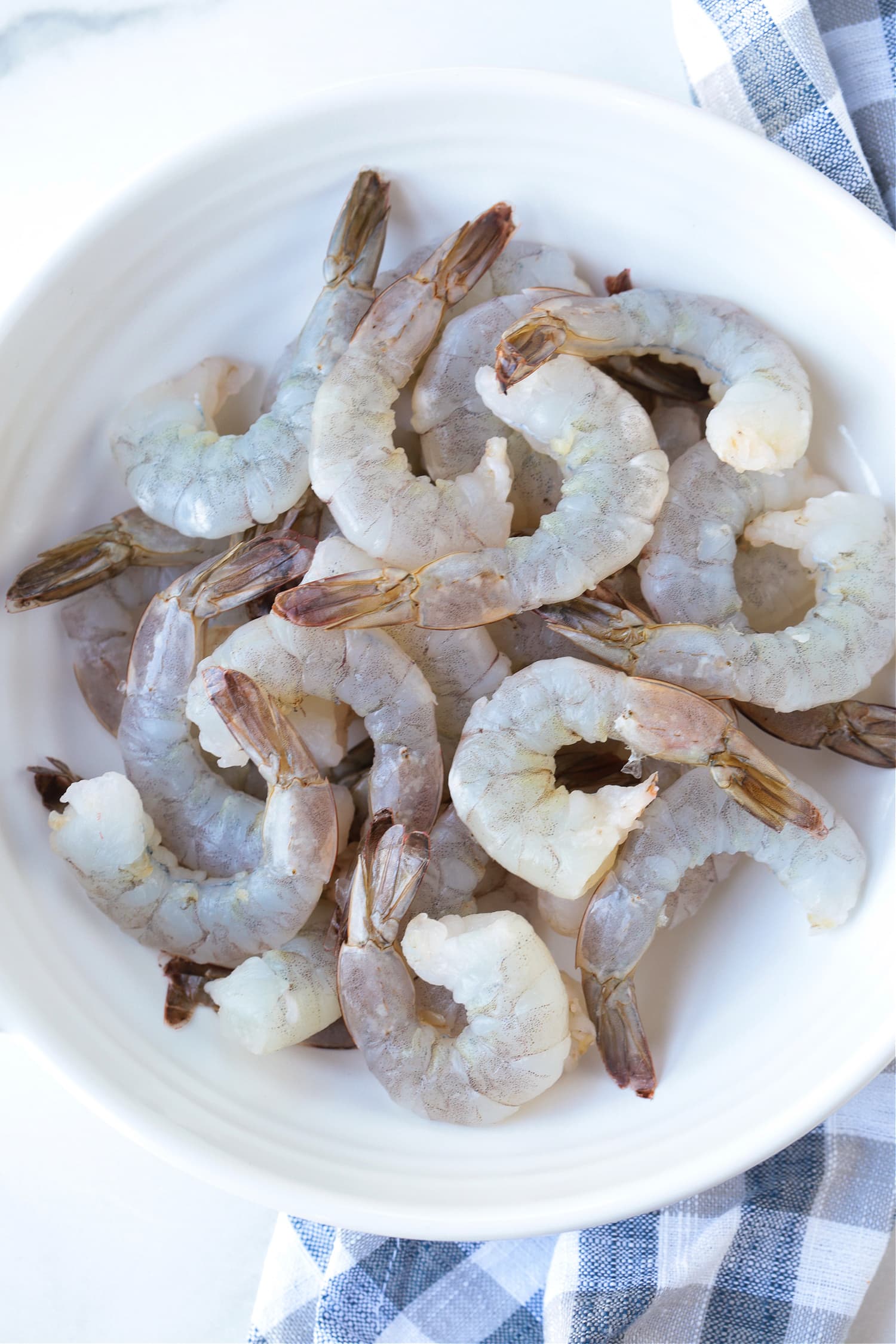 raw shrimp in a white bowl