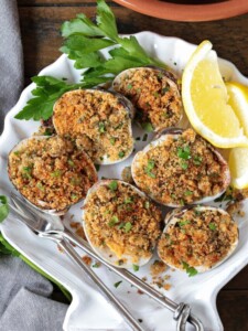 baked clams in shell dish with lemons and parsley