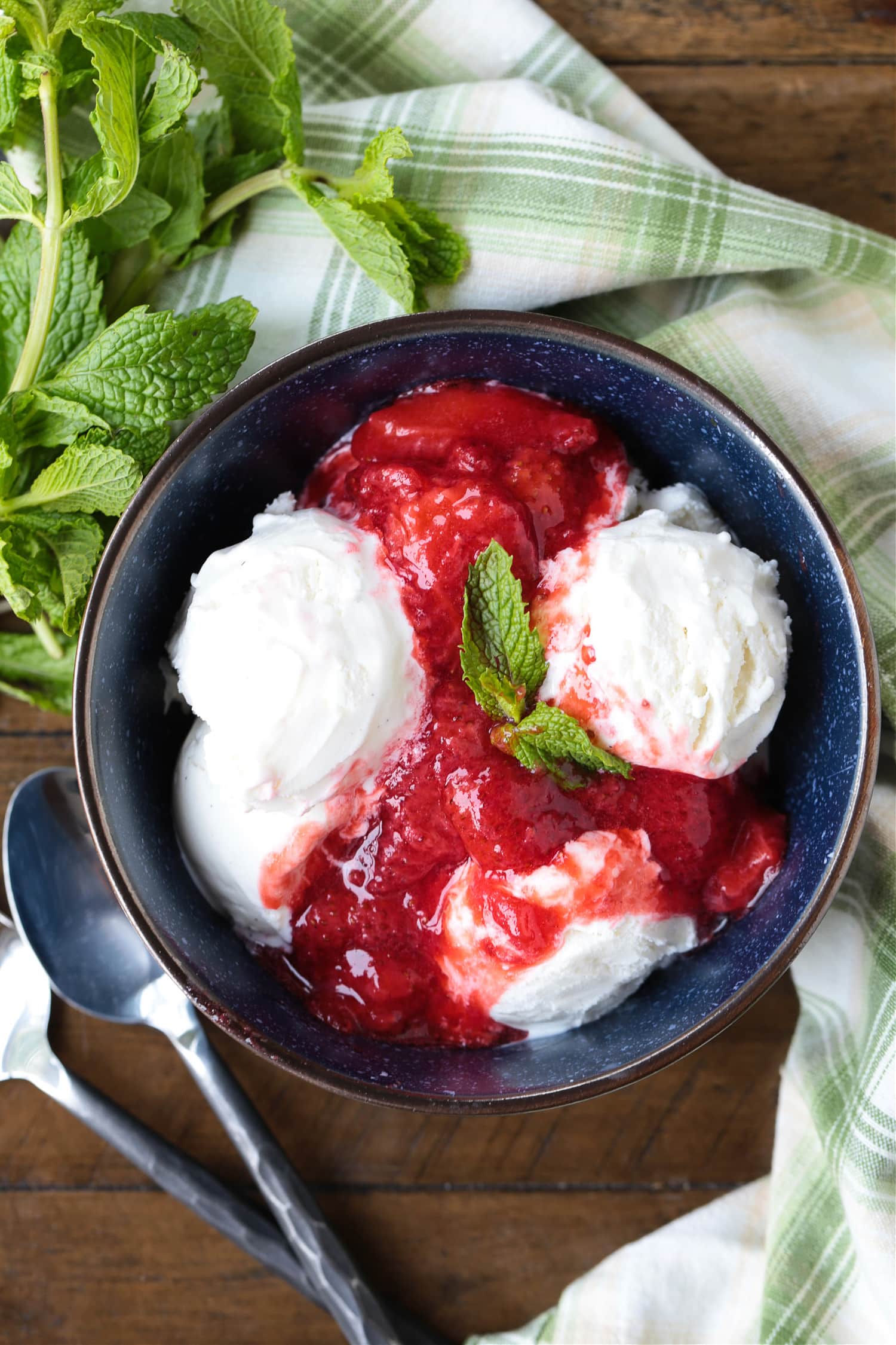 ice cream in a bowl with homemade strawberry compote