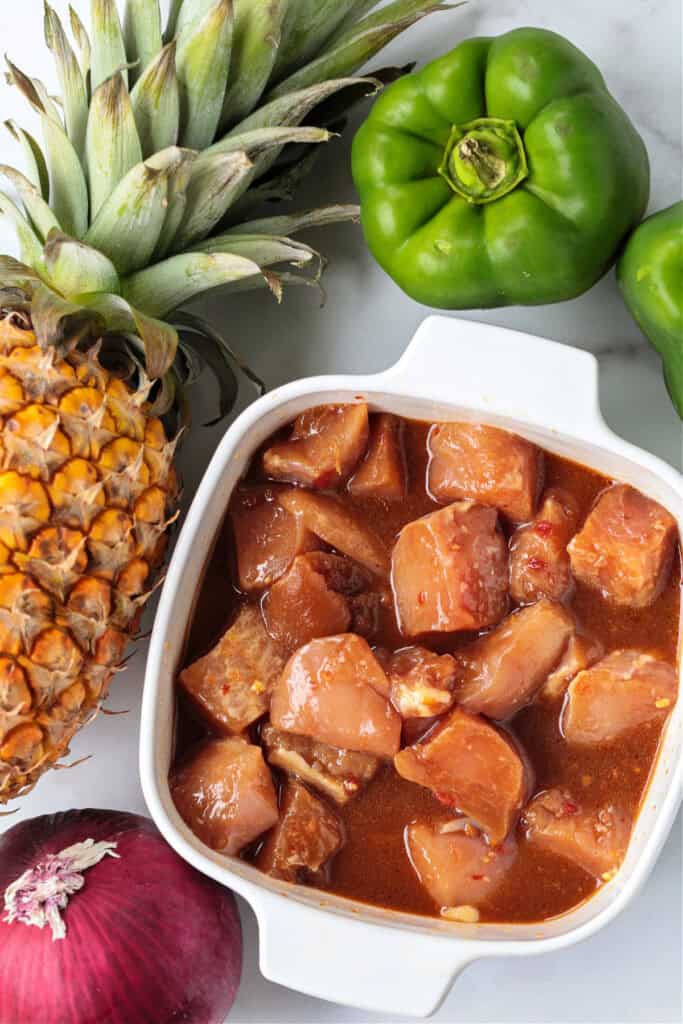 Chicken Pineapple Kabobs are a fun and tasty dinner! Sweet, grilled pineapple combined with juicy, marinated chicken and roasted vegetables. ingredients for making chicken pineapple kabobs