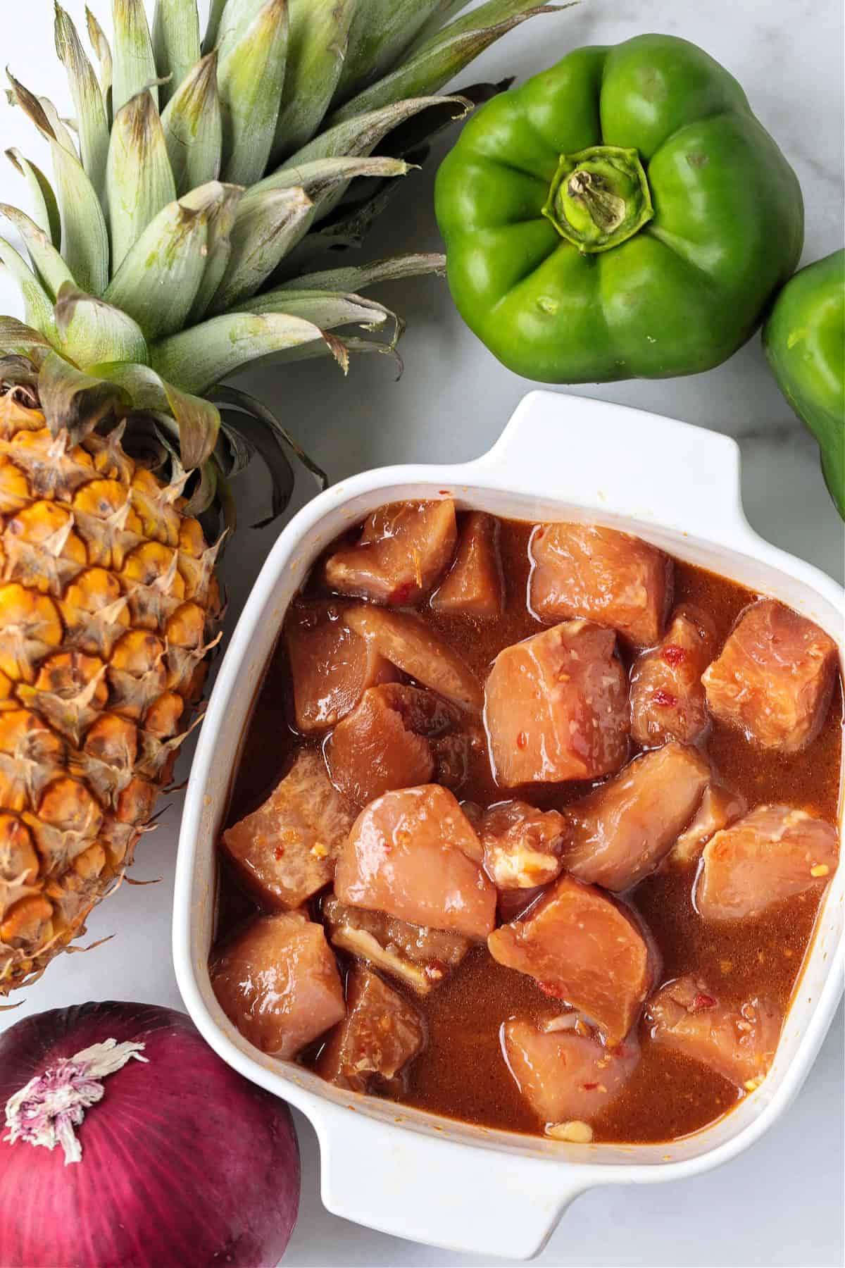 Chicken Pineapple Kabobs are a fun and tasty dinner! Sweet, grilled pineapple combined with juicy, marinated chicken and roasted vegetables. ingredients for making chicken pineapple kabobs