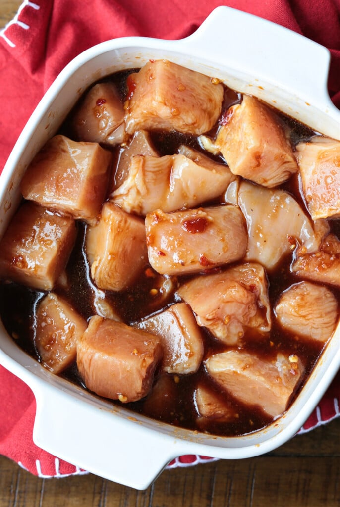 marinated, cubed chicken in dish