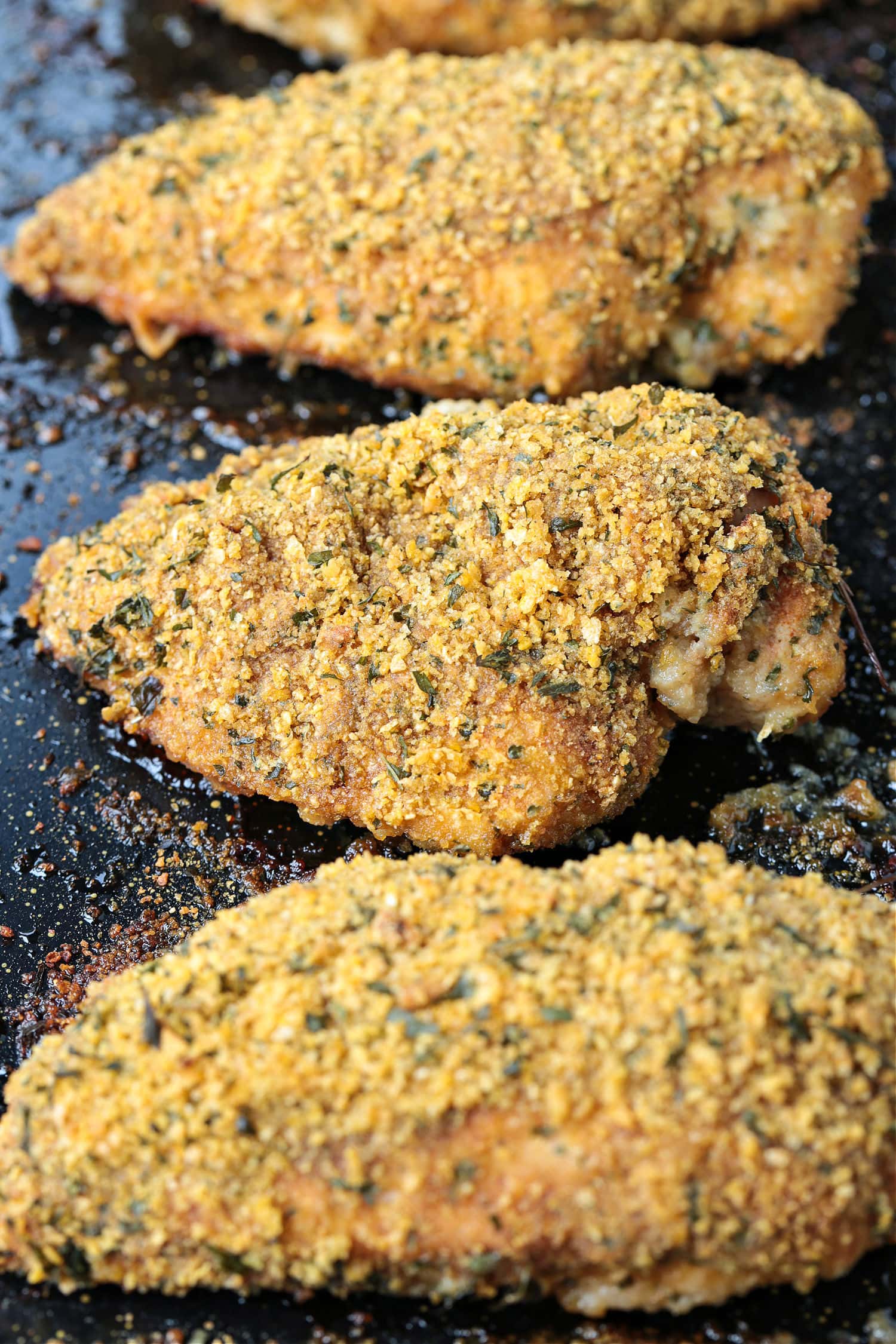 cornflake baked chicken on baking sheet