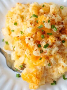 party potatoes casserole on plate with chives