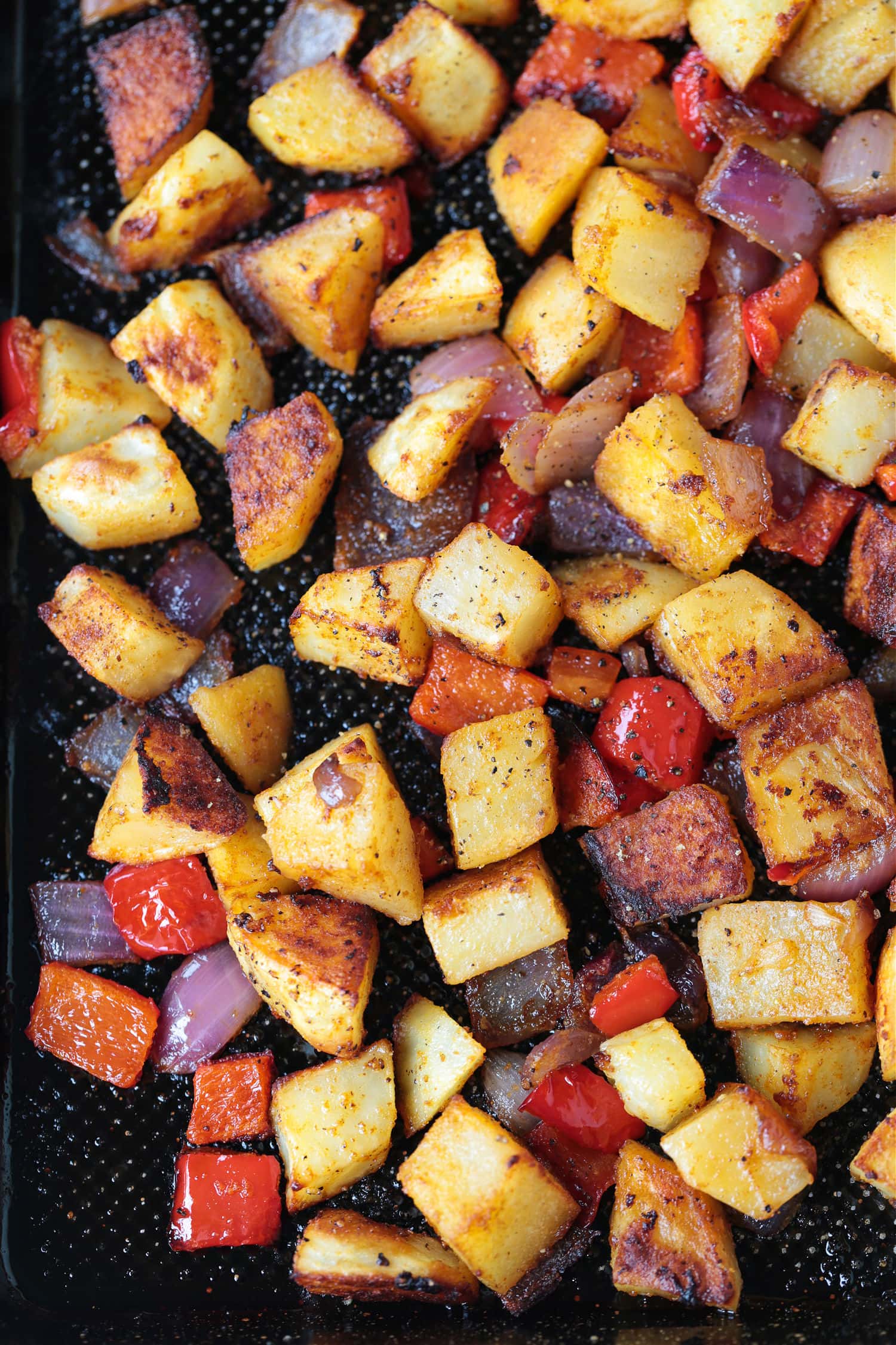 These Crispy Breakfast Potatoes are perfectly seasoned and roasted to perfection. A tasty side dish for breakfast, brunch or dinner! breakfast potatoes on a sheet pan