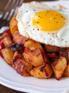 fried egg on a bed of breakfast potatoes