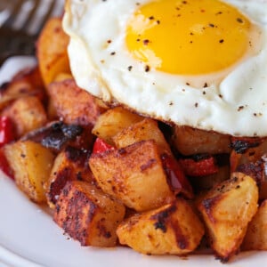 fried egg on a bed of breakfast potatoes