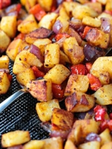 breakfast potatoes on sheet pan with spatula