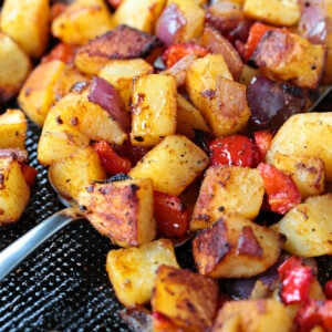 breakfast potatoes on sheet pan with spatula