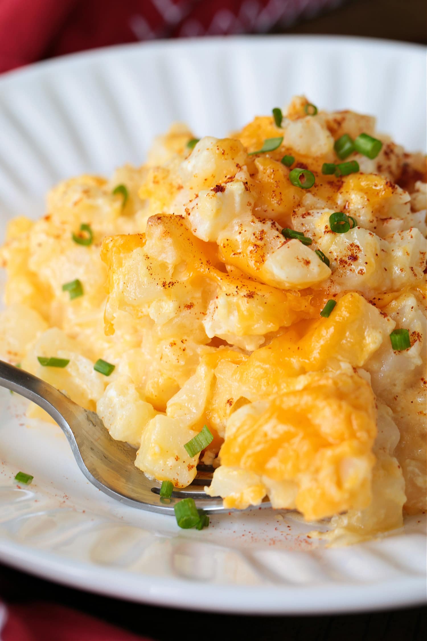 potato casserole on plate with fork