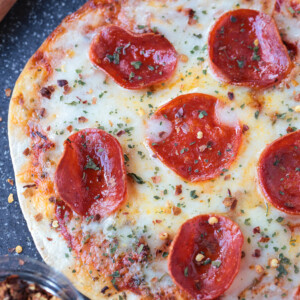 air fryer pizza with pepperoni on cutting board
