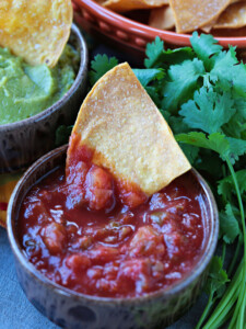air fryer tortilla chip dipped in salsa
