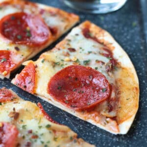 tortilla pizza cut into a wedge