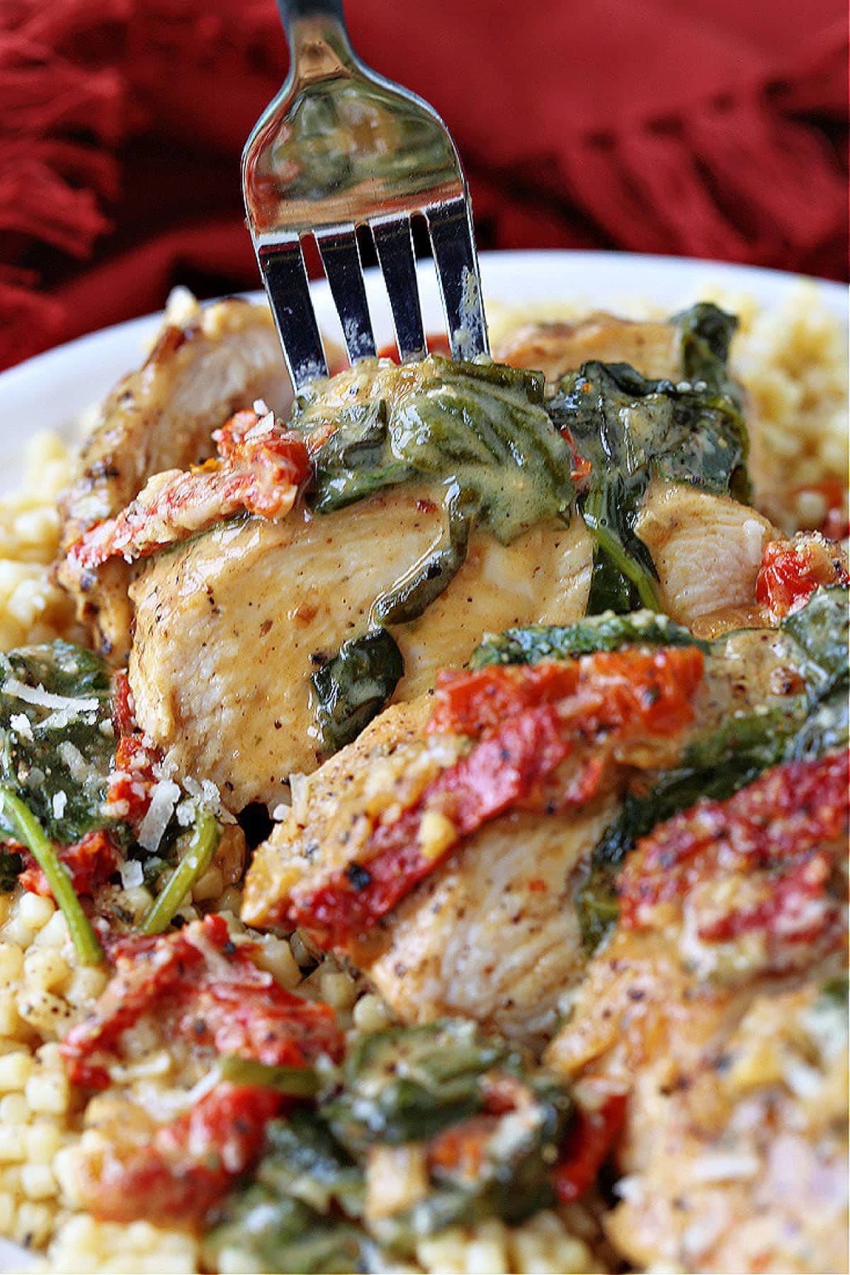 sliced chicken breasts with spinach and sun dried tomatoes