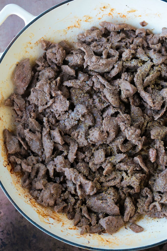 shaved beef in skillet