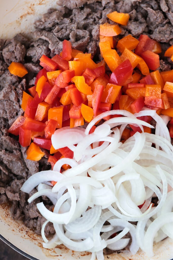 beef, peppers and onions in skillet