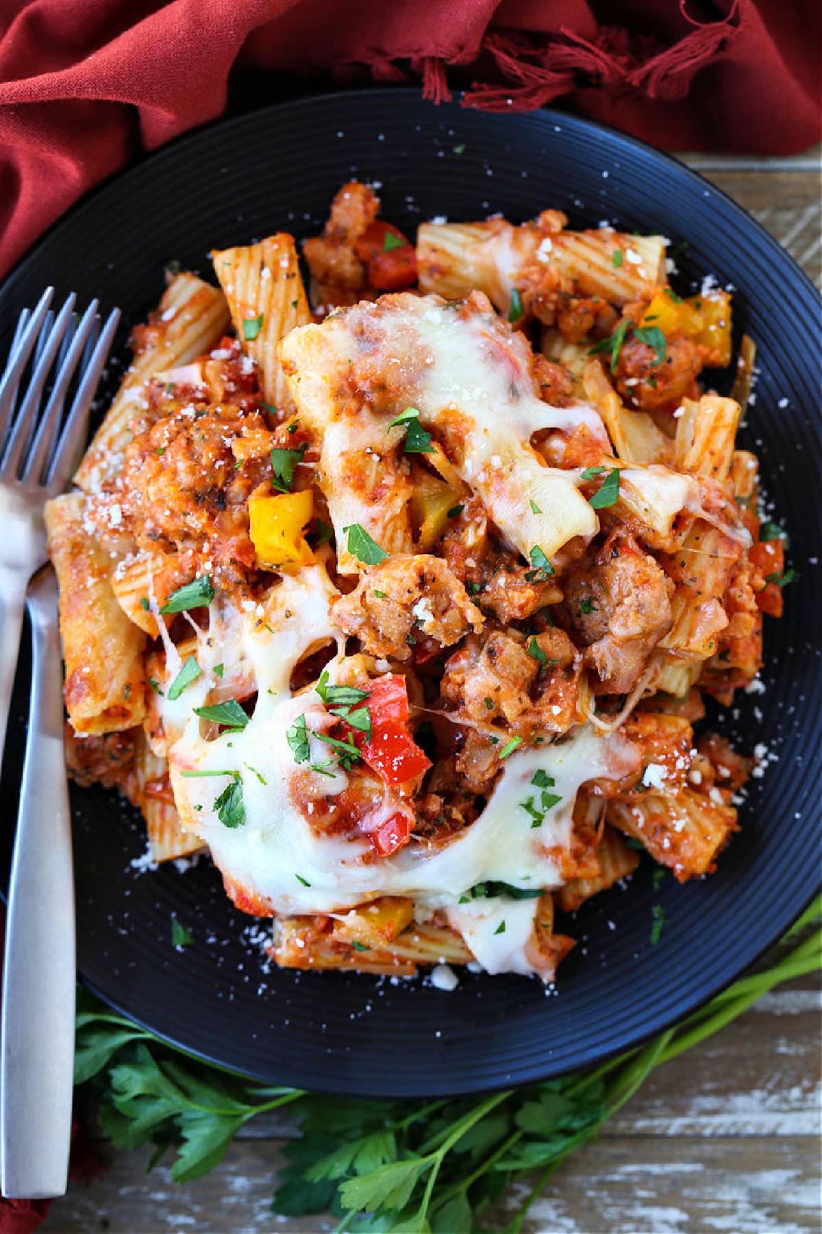 baked ziti with sausage and peppers on plate