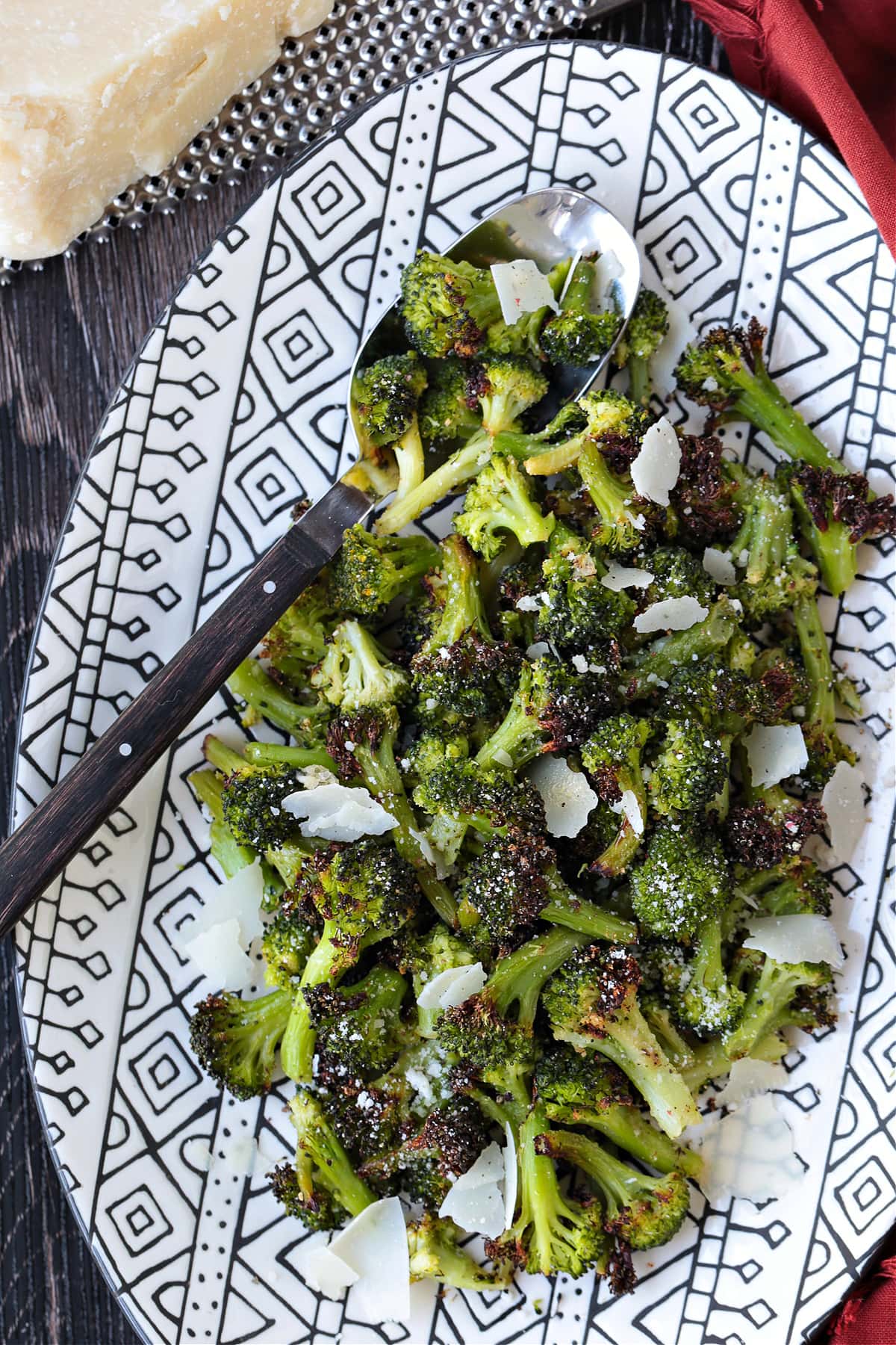 air fryer broccoli on platter with spoon