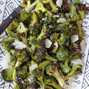 air fryer broccoli on platter with parmesan cheese