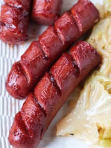 cooked kielbasa basted with barbecue sauce