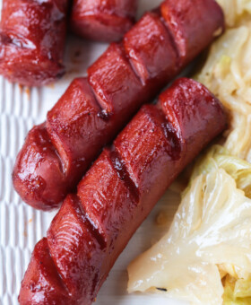 cooked kielbasa basted with barbecue sauce