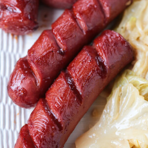 cooked kielbasa basted with barbecue sauce
