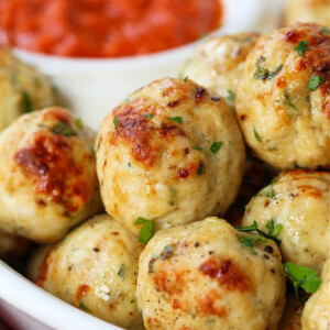 chicken meatballs in a white bowl with marinara sauce