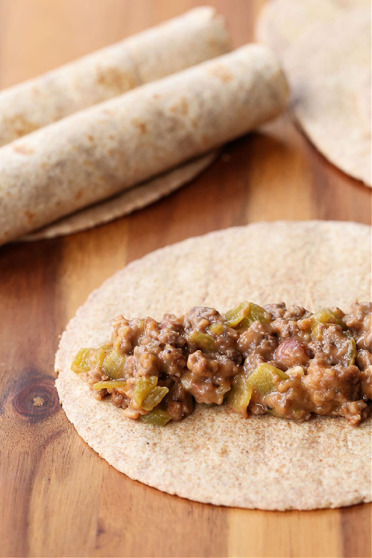 beef and cheese filling in a tortilla