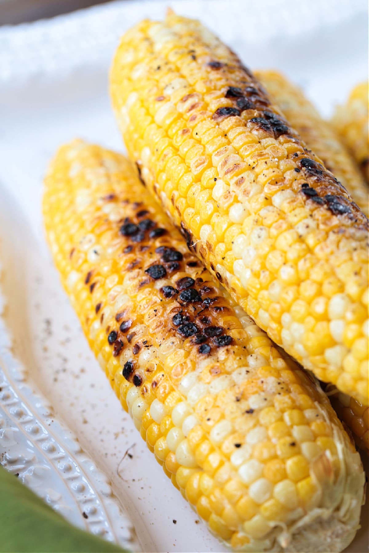 Corn on the Cob on the Grill is an easy and delicious way to make corn! Sweet corn with a charred flavor that makes the perfect summer side! corn on the cob made on the grill