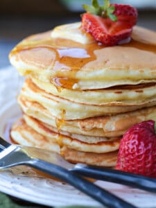 stack of pancakes with syrup dripping down